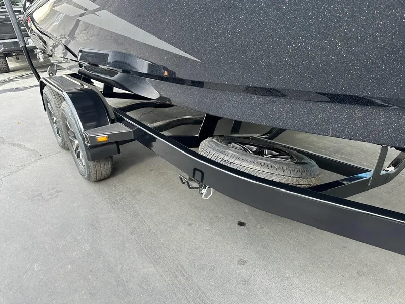 Slide: The Image of 2024 Sanger V237 SX boat trailer with spare tire, black finish. - 25