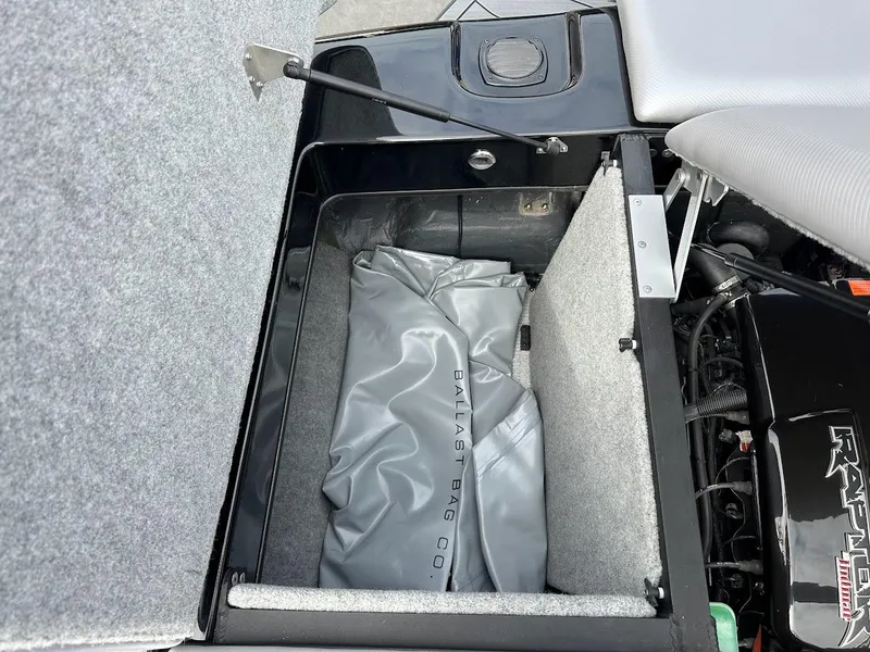 Slide: The Image of Open storage compartment in 2024 Sanger V237 SX boat. - 28