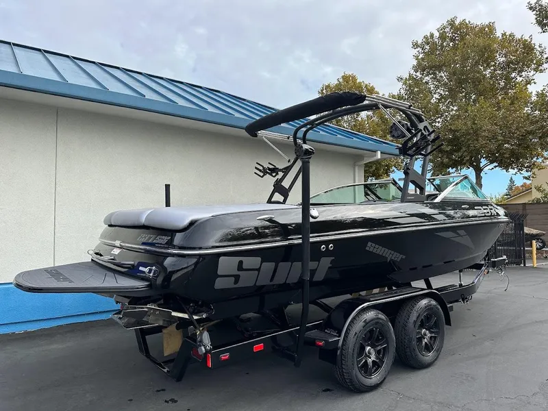 Slide: The Image of 2024 Sanger V237 SX boat with black exterior on a trailer. - 4