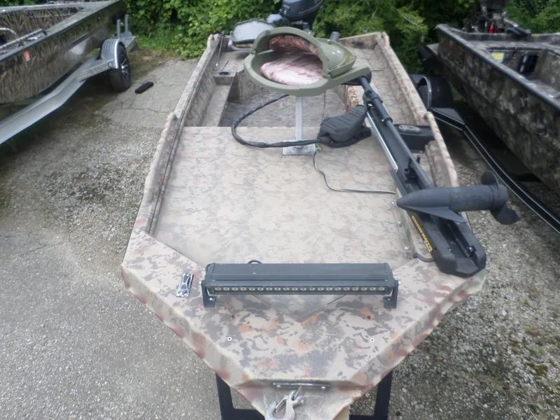 Slide: The Image of 2012 Excel 1751 VF4 boat with camouflage pattern and mounted equipment. - 2