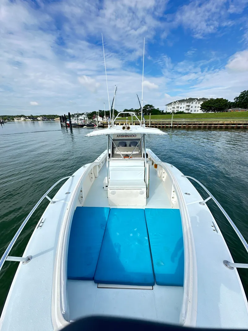 Slide: The Image of 1988 Ocean Master 31 Center Console boat on calm water. - 16