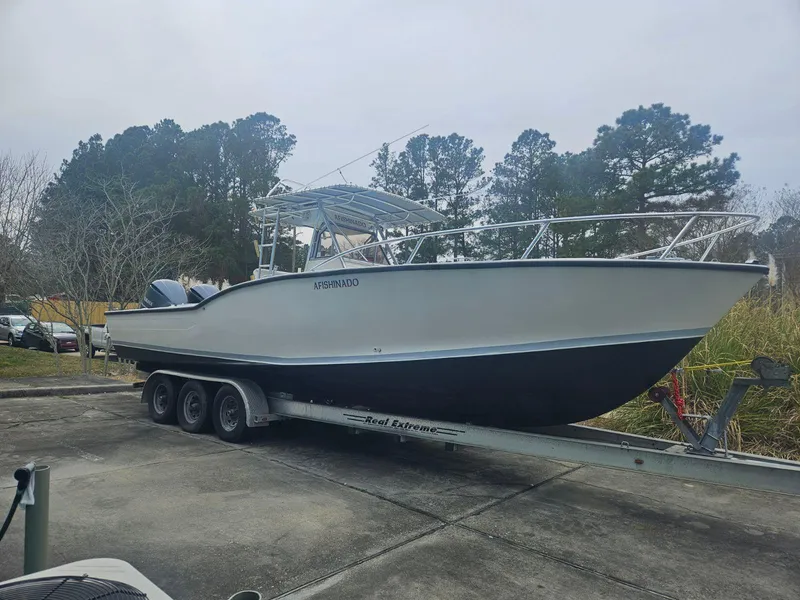 Slide: The Image of 1988 Ocean Master 31 Center Console boat on a trailer. - 4