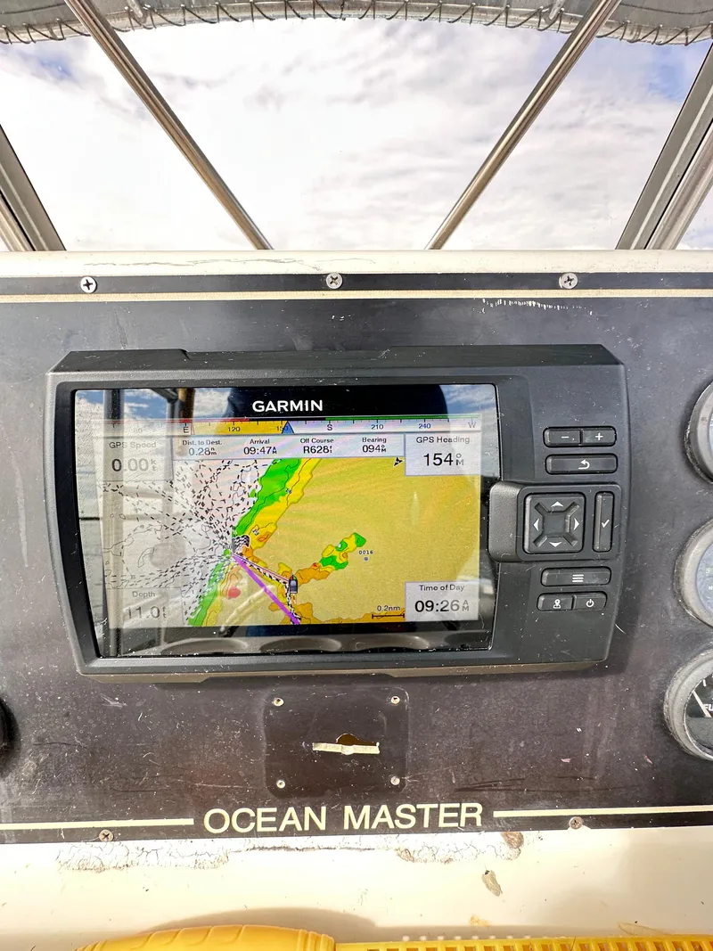 Slide: The Image of Garmin navigation system on 1988 Ocean Master 31 Center Console boat. - 12