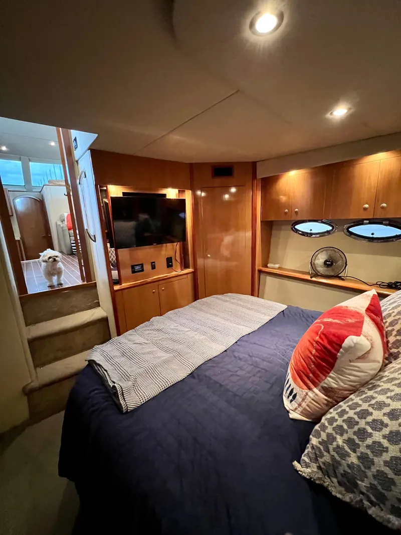 Slide: The Image of Luxurious 2008 Cruisers 395 Motoryacht bedroom with cozy bedding and modern amenities. - 13