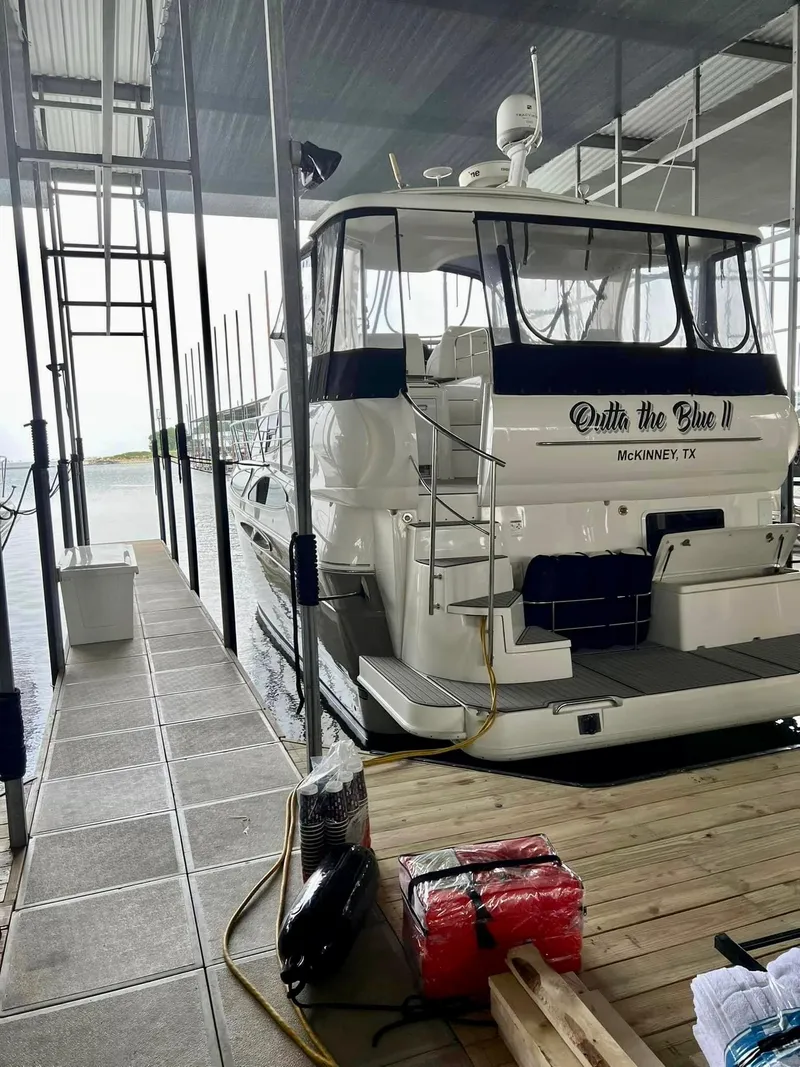 Slide: The Image of 2008 Cruisers 395 Motoryacht docked in marina, rear view with covered deck. - 15