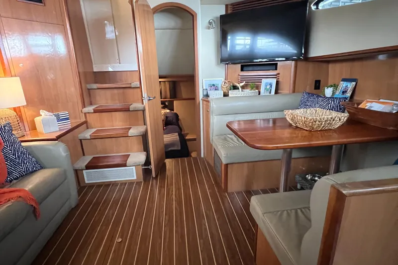 Slide: The Image of Interior of 2008 Cruisers 395 Motoryacht with wood flooring and cozy seating area. - 25