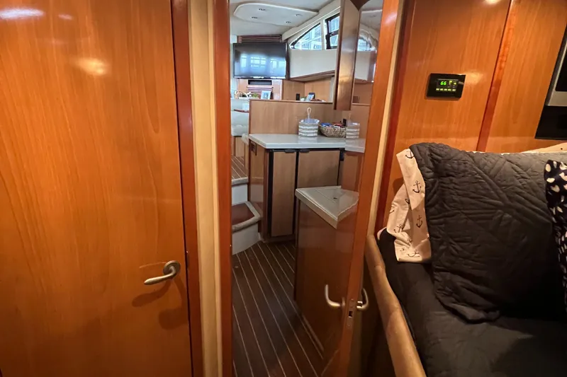 Slide: The Image of 2008 Cruisers 395 Motoryacht interior with wood finish and cozy seating area. - 26