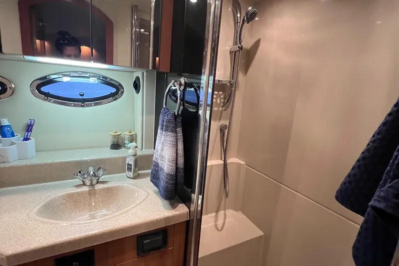 Slide: The Image of 2008 Cruisers 395 Motoryacht bathroom with sink, mirror, and shower. - 30