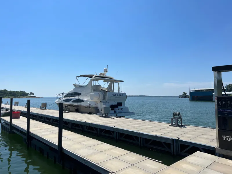 Slide: The Image of 2008 Cruisers 395 Motoryacht docked on a sunny day by the water. - 4