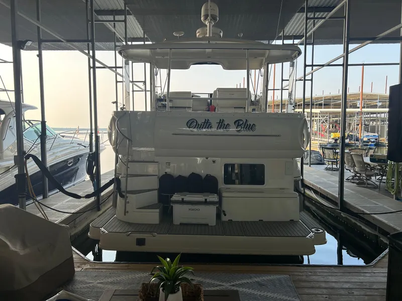 Slide: The Image of 2008 Cruisers 395 Motoryacht docked in a marina, rear view. - 5