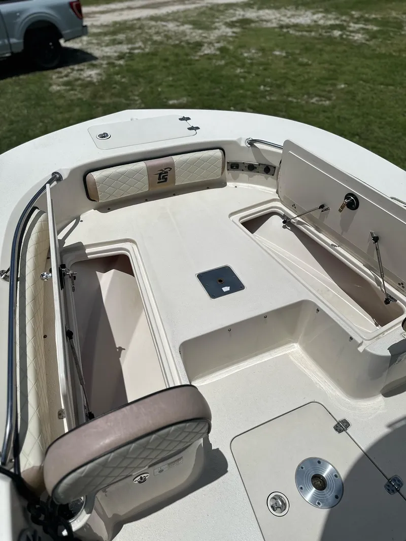 Slide: The Image of 2023 Carolina Skiff 24 Ultra Elite boat interior with storage compartments. - 11