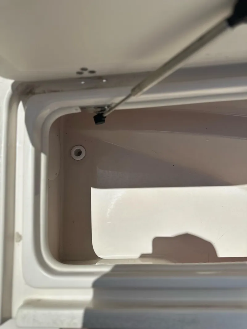 Slide: The Image of 2023 Carolina Skiff 24 Ultra Elite storage compartment. - 12