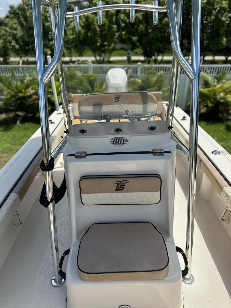Slide: The Image of 2023 Carolina Skiff 24 Ultra Elite boat interior with seating and console. - 16