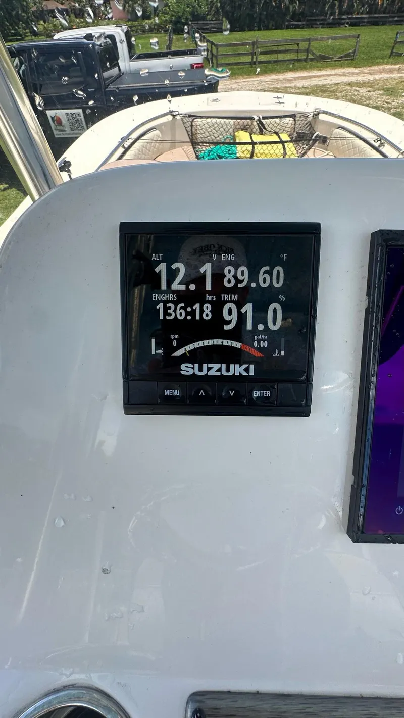 Slide: The Image of Suzuki display on 2023 Carolina Skiff 24 Ultra Elite boat dashboard. - 22