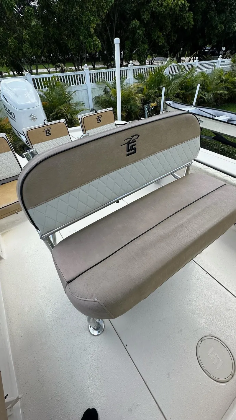 Slide: The Image of 2023 Carolina Skiff 24 Ultra Elite boat interior with cushioned seating. - 27