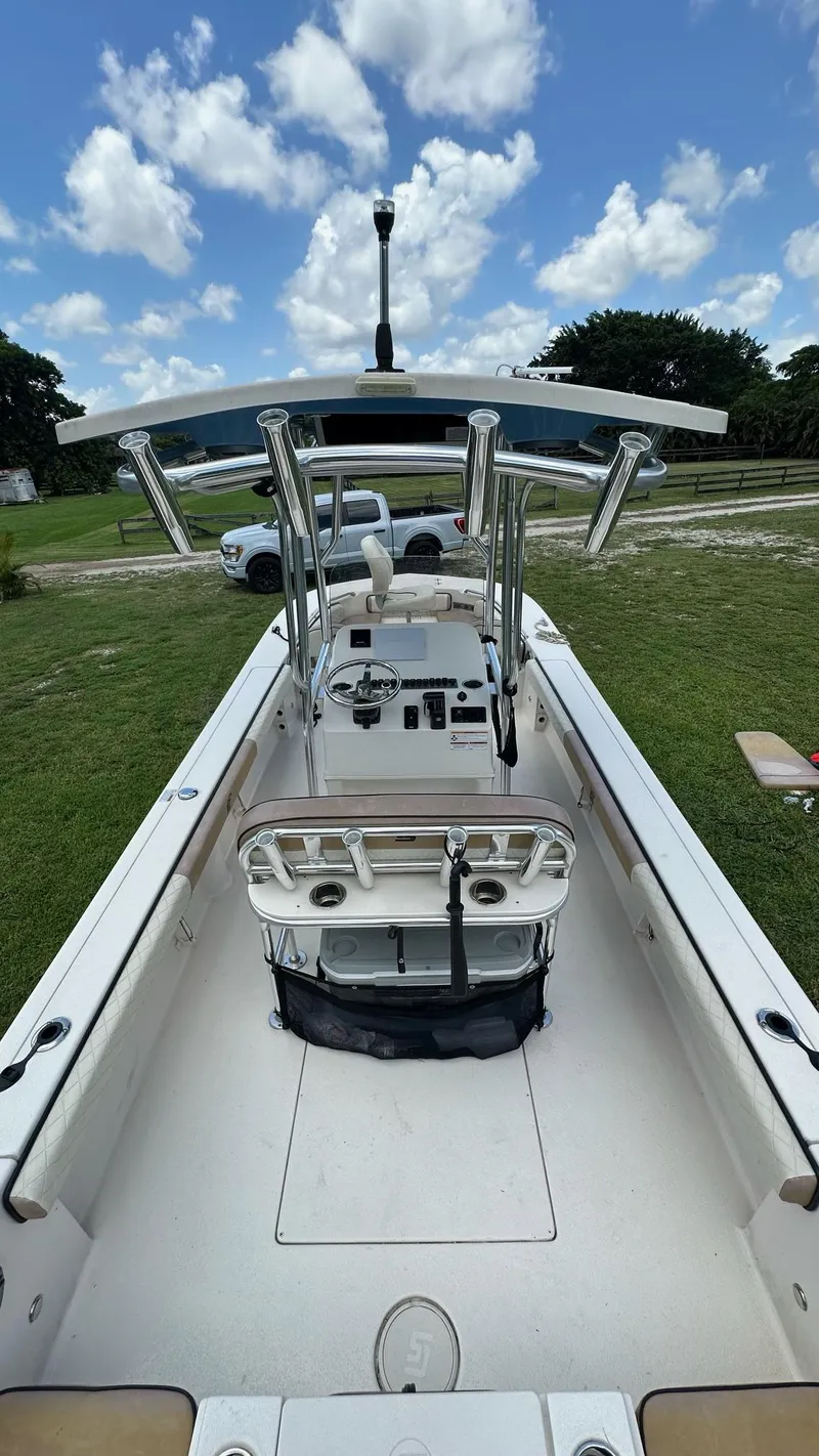 Slide: The Image of 2023 Carolina Skiff 24 Ultra Elite boat with T-top and center console. - 29