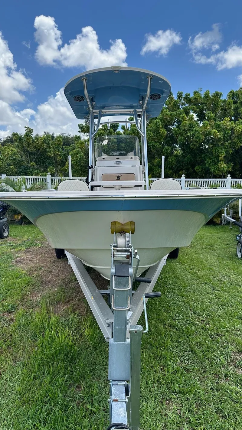 Slide: The Image of 2023 Carolina Skiff 24 Ultra Elite boat on trailer, front view, outdoors. - 3