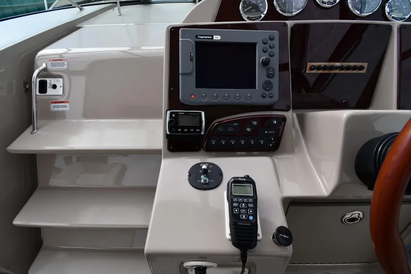Slide: The Image of Control panel of a 2009 Sea Ray 330 Sundancer boat with navigation equipment. - 12