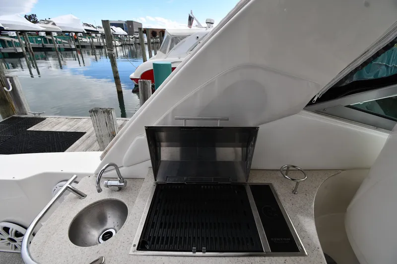 Slide: The Image of Outdoor kitchen on 2009 Sea Ray 330 Sundancer yacht with grill and sink at marina. - 20