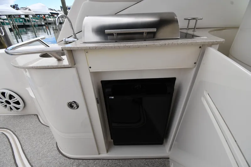 Slide: The Image of Outdoor kitchenette on 2009 Sea Ray 330 Sundancer yacht with grill and mini fridge. - 21
