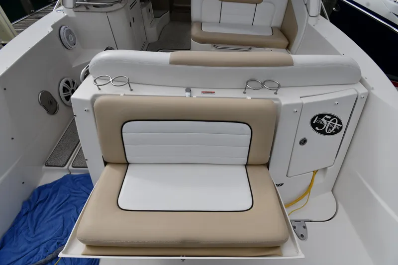 Slide: The Image of 2009 Sea Ray 330 Sundancer boat interior with beige and white seating. - 23