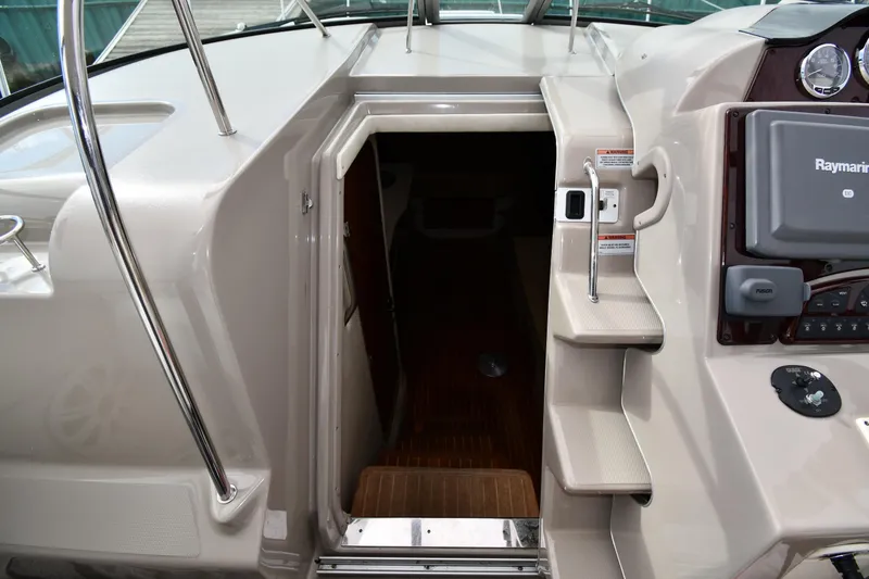 Slide: The Image of 2009 Sea Ray 330 Sundancer cabin entrance with steps and control panel. - 24