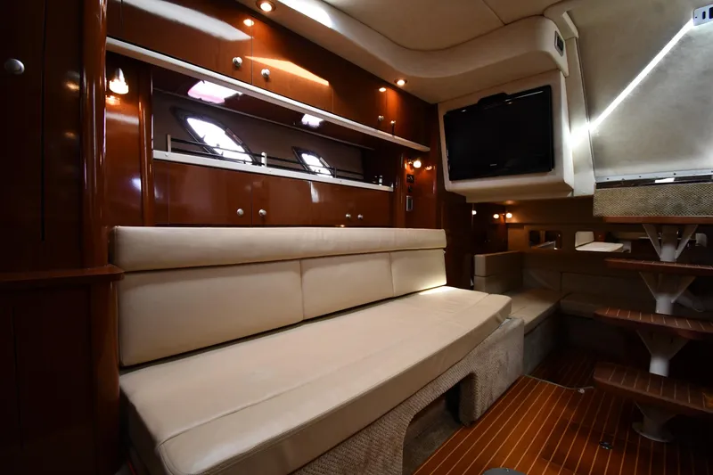 Slide: The Image of Luxurious interior of 2009 Sea Ray 330 Sundancer yacht with plush seating and modern amenities. - 33