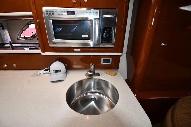Slide: The Image of Galley of 2009 Sea Ray 330 Sundancer with sink, microwave, and coffee maker. - 34