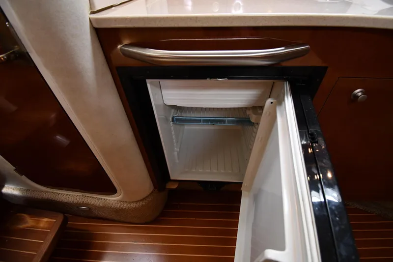Slide: The Image of Open refrigerator in 2009 Sea Ray 330 Sundancer yacht interior. - 36