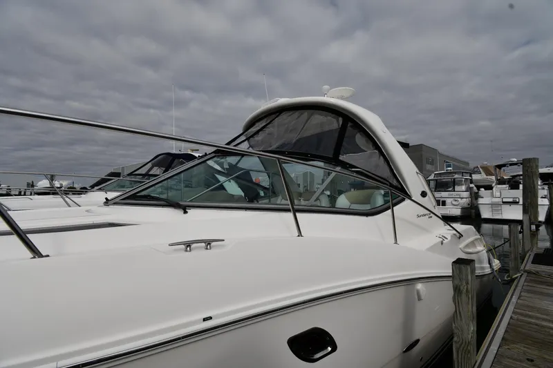 Slide: The Image of 2009 Sea Ray 330 Sundancer docked at marina under cloudy sky. - 4