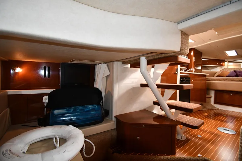 Slide: The Image of Interior of 2009 Sea Ray 330 Sundancer yacht with wooden flooring and modern amenities. - 41