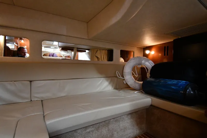 Slide: The Image of Interior of 2009 Sea Ray 330 Sundancer yacht with beige seating and life preserver. - 42