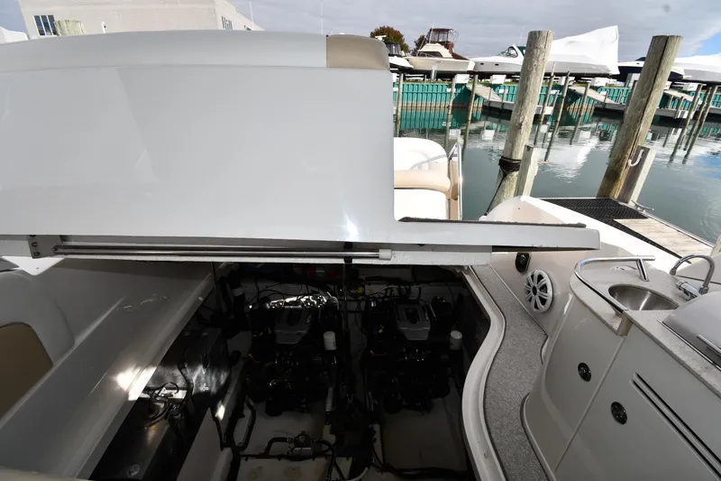Slide: The Image of Engine compartment of 2009 Sea Ray 330 Sundancer at marina dock. - 44