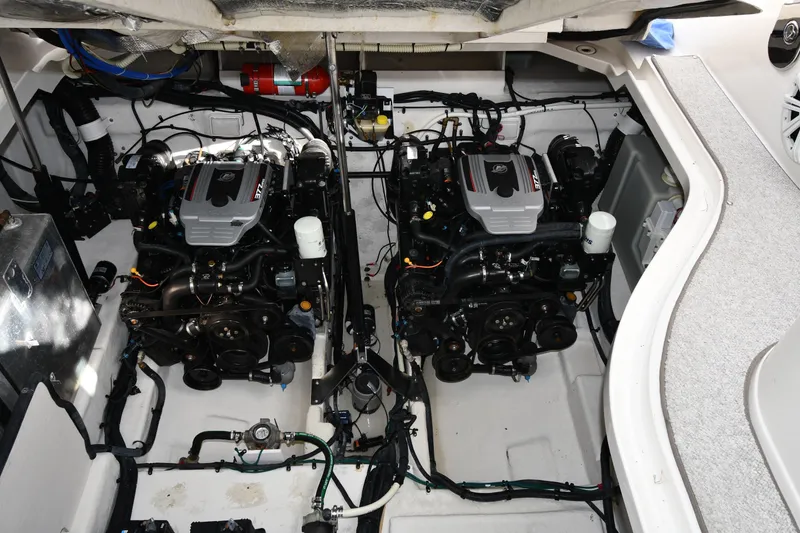 Slide: The Image of Engine compartment of 2009 Sea Ray 330 Sundancer with dual engines and clean layout. - 45