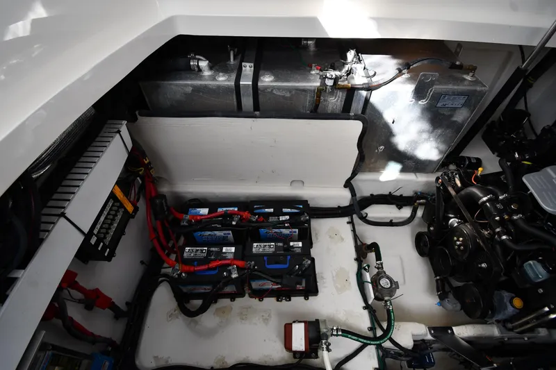 Slide: The Image of Engine compartment of 2009 Sea Ray 330 Sundancer with batteries and mechanical components. - 47
