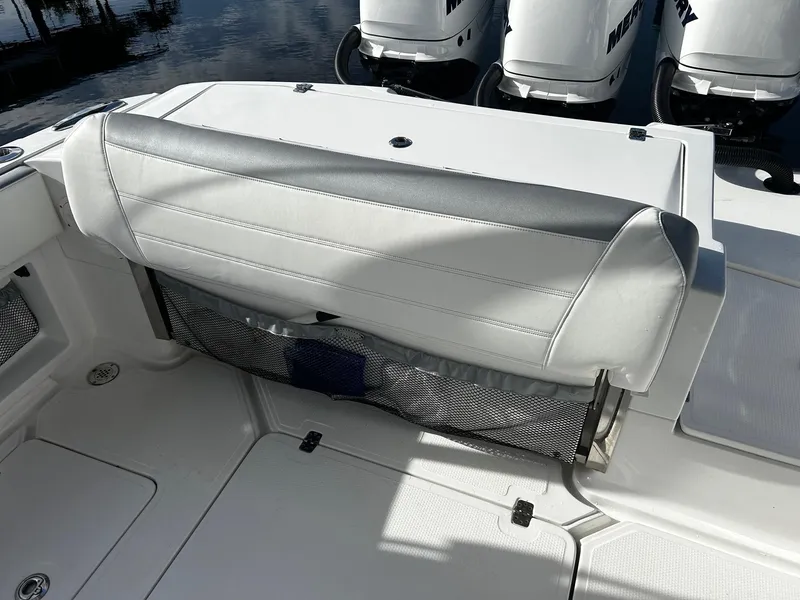 Slide: The Image of 2021 Nor-Tech 390 Sport Center Console boat seating and storage area. - 10