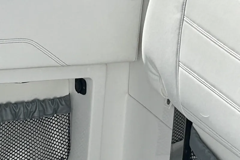 Slide: The Image of Interior detail of 2021 Nor-Tech 390 Sport Center Console boat with white upholstery. - 22