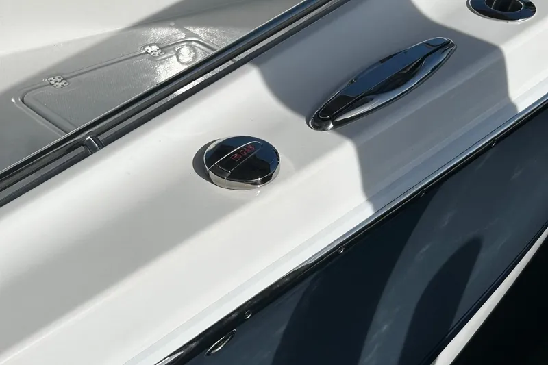 Slide: The Image of 2021 Nor-Tech 390 Sport Center Console boat deck with chrome fixtures. - 23