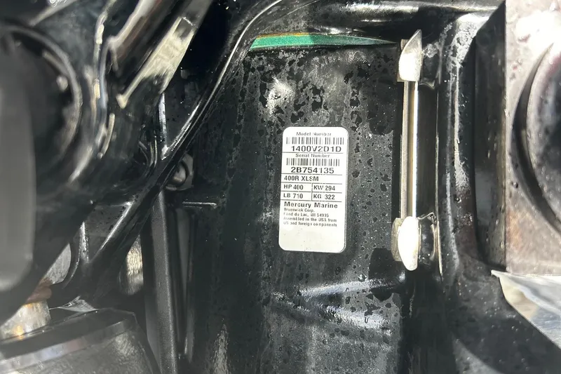 Slide: The Image of 2021 Nor-Tech 390 Sport Center Console engine label with specifications. - 27