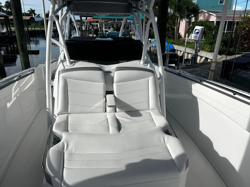 Slide: The Image of 2021 Nor-Tech 390 Sport Center Console boat with white seating. - 5