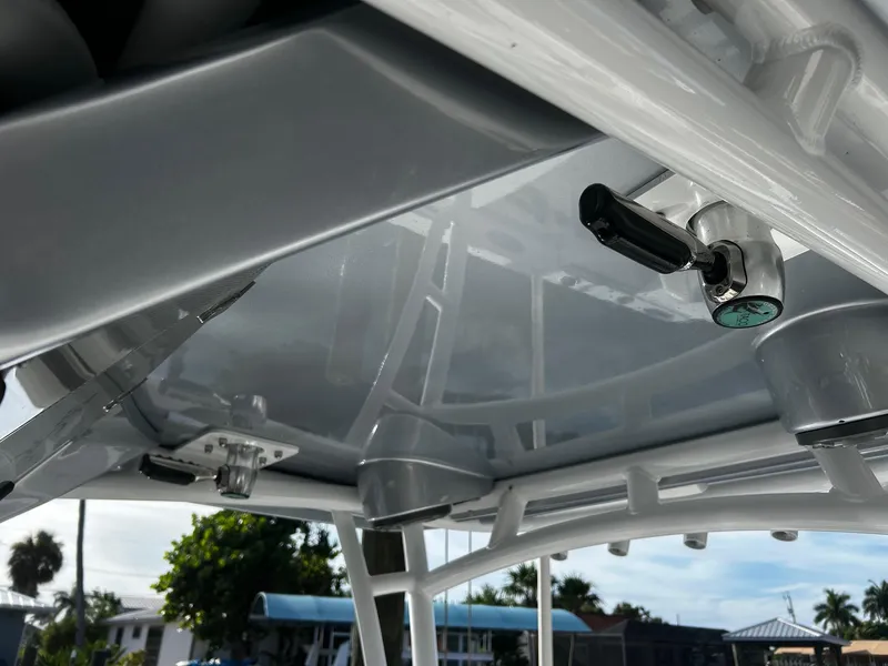 Slide: The Image of Close-up of the 2021 Nor-Tech 390 Sport Center Console's T-top structure. - 9