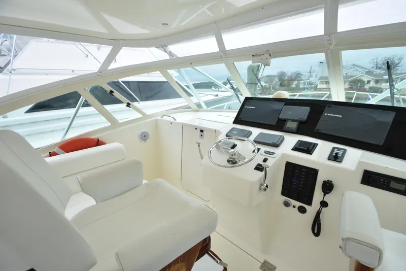 Slide: The Image of Interior helm of 2006 Albemarle 41 Express boat with modern navigation equipment. - 13