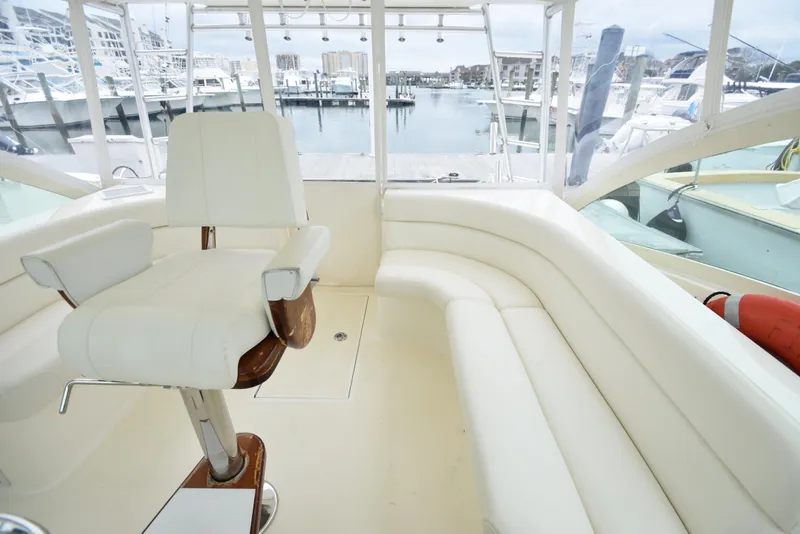 Slide: The Image of Interior of 2006 Albemarle 41 Express yacht with white seating and captain's chair. - 15