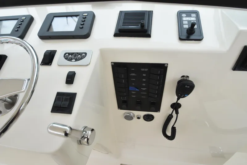 Slide: The Image of 2006 Albemarle 41 Express helm controls and navigation equipment. - 23