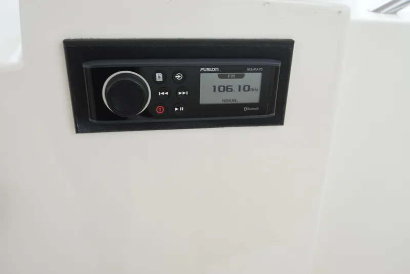 Slide: The Image of Fusion MS-RA70 radio on 2006 Albemarle 41 Express boat, tuned to 106.10 FM. - 24