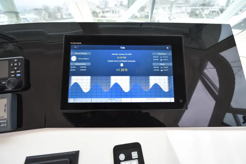 Slide: The Image of Navigation display on 2006 Albemarle 41 Express showing tide and moon phase information. - 31
