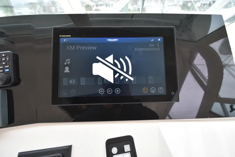 Slide: The Image of 2006 Albemarle 41 Express boat dashboard with Furuno display showing XM Preview. - 32