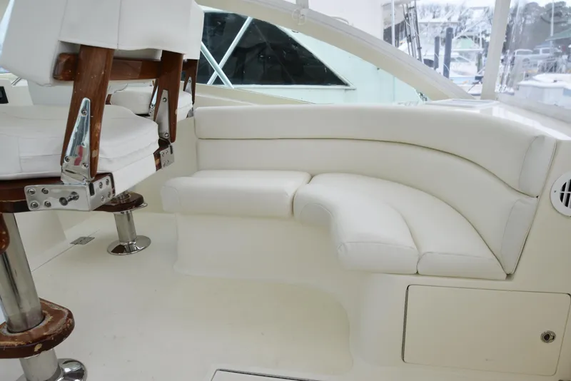 Slide: The Image of Interior seating of 2006 Albemarle 41 Express boat with white leather upholstery. - 34