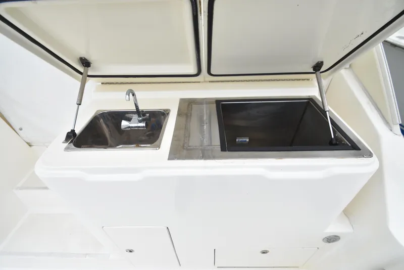 Slide: The Image of 2006 Albemarle 41 Express boat sink and storage compartment - 39
