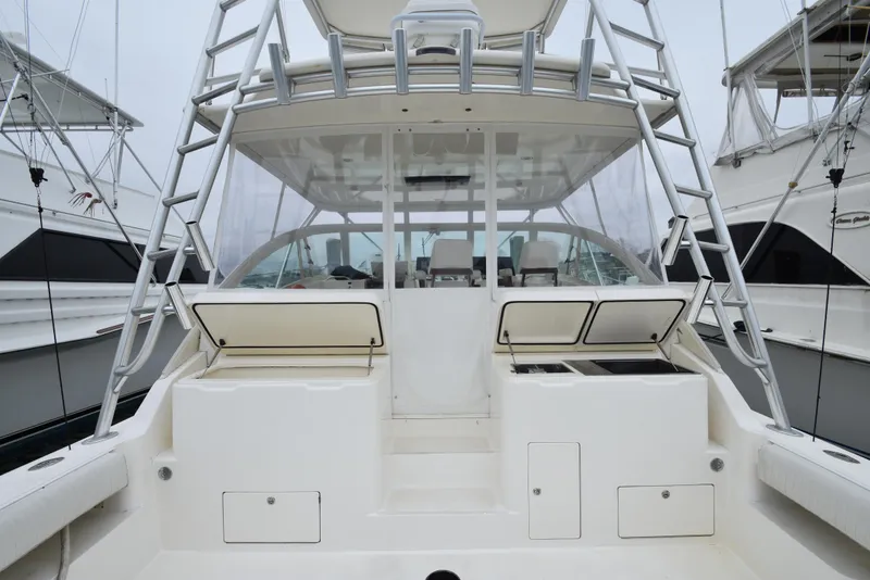 Slide: The Image of 2006 Albemarle 41 Express boat cockpit with storage compartments and ladder. - 41
